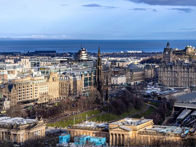 Edinburgh city centre with the Scott Monument and the Firth of Forth